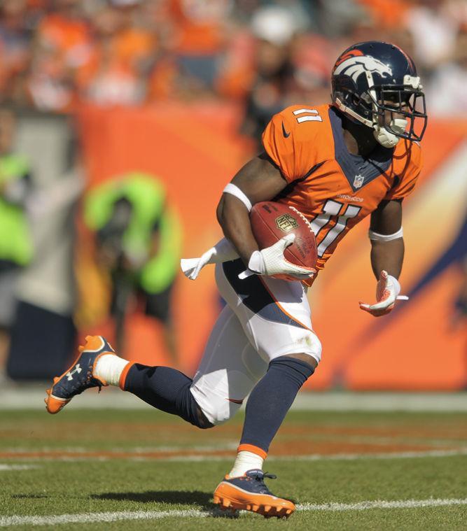 Denver Broncos wide receiver Trindon Holliday (11) runs back a kick-off return 105 yards for a touchdown against the Philadelphia Eagles in the first quarter of an NFL football game, Sunday, Sept. 29, 2013, in Denver. (AP Photo/Jack Dempsey)