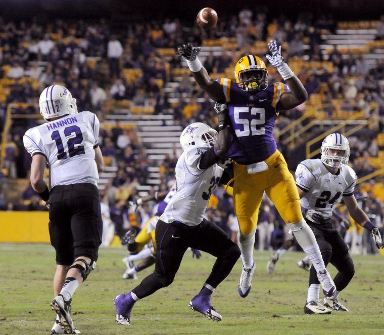 LSU freshman line backer Kendell Beckwith (52) catches a pass Saturday night, Oct. 26, 2013 during the Tigers' 48-16 win against Furman in Tiger Stadium.