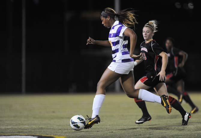 LSU senior defender Nina Anderson (21) drives the ball downfield Friday, Oct. 25, 2013 during the Tigers' 2-1 loss against Georgia.