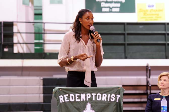 Olympian gold medalist and WNBA Superstar, Lisa Leslie, speaks Tuesday, Oct. 22, 2013, to students at Redemptorist High School about her achievements and future endeavors.