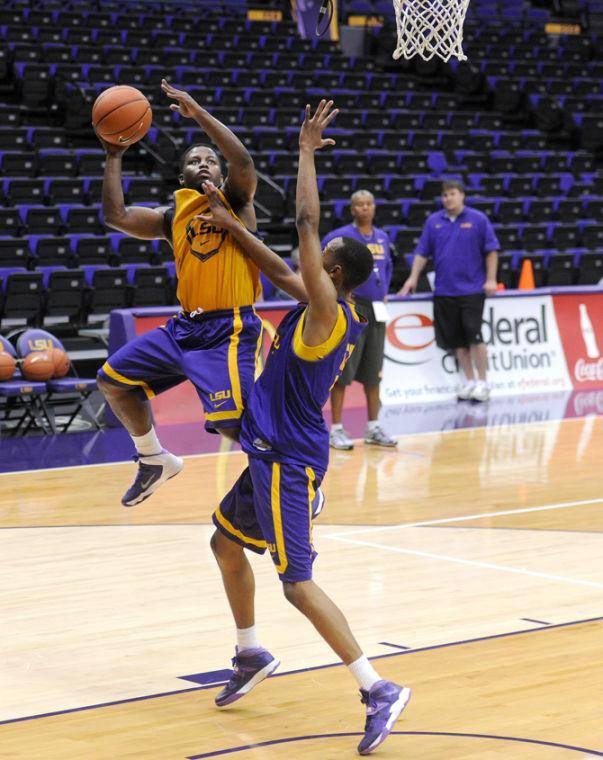 LSU senior guard Andre Stringer (10) lays up the basketball Tuesday, Oct. 1, 2013 during the men's basketball practice in the PMAC.