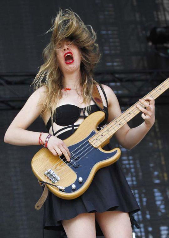 Haim's Este Haim performs on Day 2 of the 2013 Austin City Limits Music Festival at Zilker Park on Saturday, Oct. 5, 2013 in Austin, Texas. (Photo by Jack Plunkett/Invision/AP)