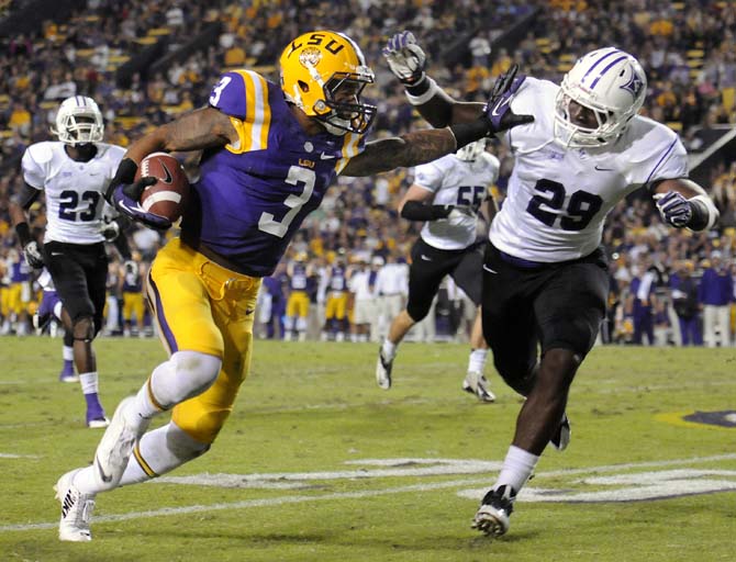 LSU junior wide reciever Odell Beckham Jr. (3) stiff-arms Furman freshman free safety Trey Robinson (29) Saturday, Oct. 26, 2013, during the Tigers' 48-16 win against Furman in Tiger Stadium.