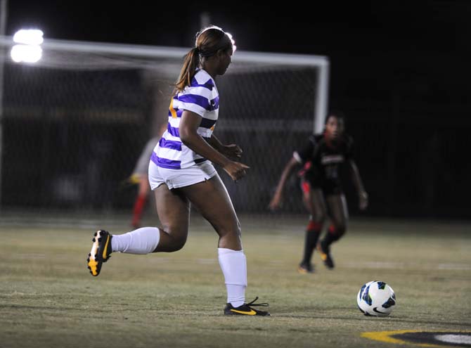 LSU senior defender Nina Anderson (21) drives the ball downfield Friday, Oct. 25, 2013 during the Tigers' 2-1 loss against Georgia.