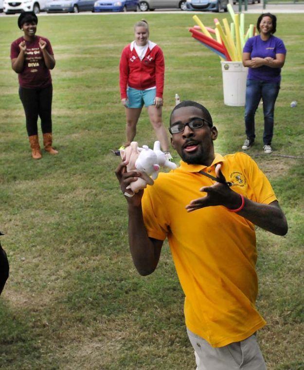 Cedric Taylor, a student from Scotlandville Magnet High School, juggles stuffed animals during an Ice Breaker game at the LSU EnvironMentors program event on Monday, Oct. 21, 2013, at the BREC Milford Wampold Memorial Park on Stanford Ave.