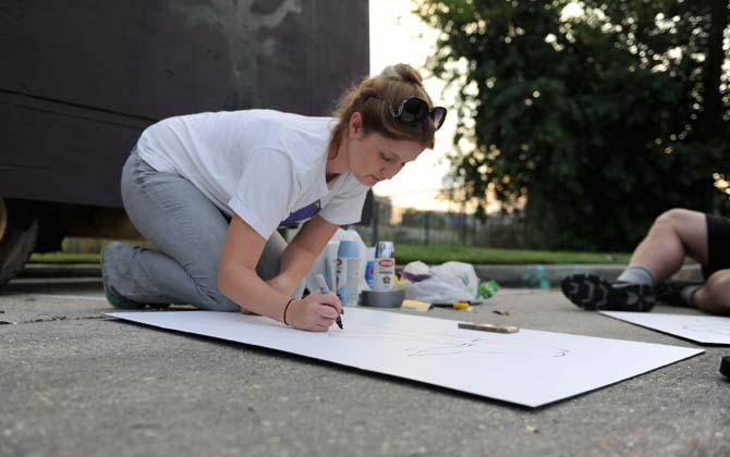 Parade captain and queen, Jessica Edwards, helps set up their float Tuesday, Oct. 15, 2013, for the upcoming 3rd Annual Halloween Parade on Saturday.