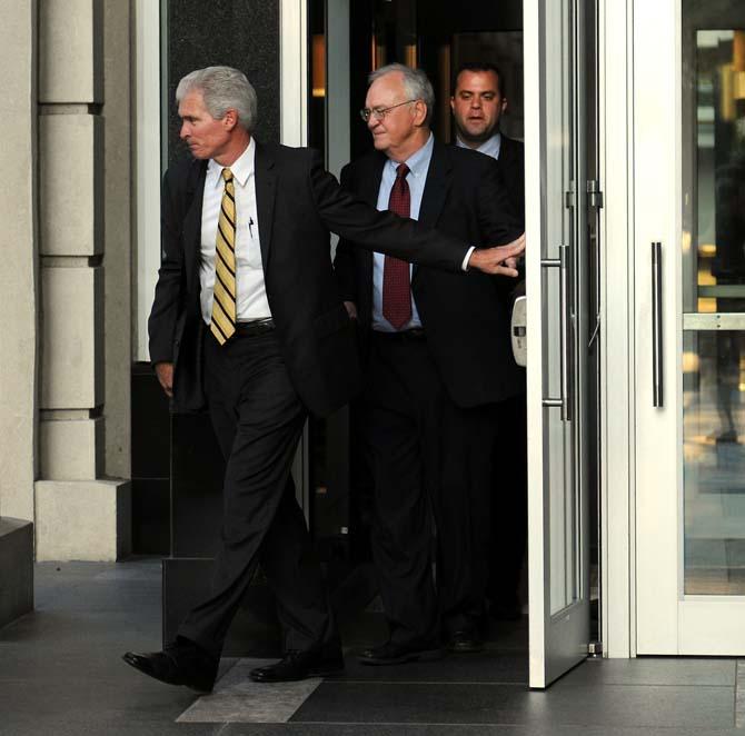 LSU's lawyer, Jimmy Faircloth, leaves the 19th Judicial Courthouse followed by LSU lead legal counsel Shelby McKenzie on Tuesday, September 10, 2013 in downtown Baton Rouge.