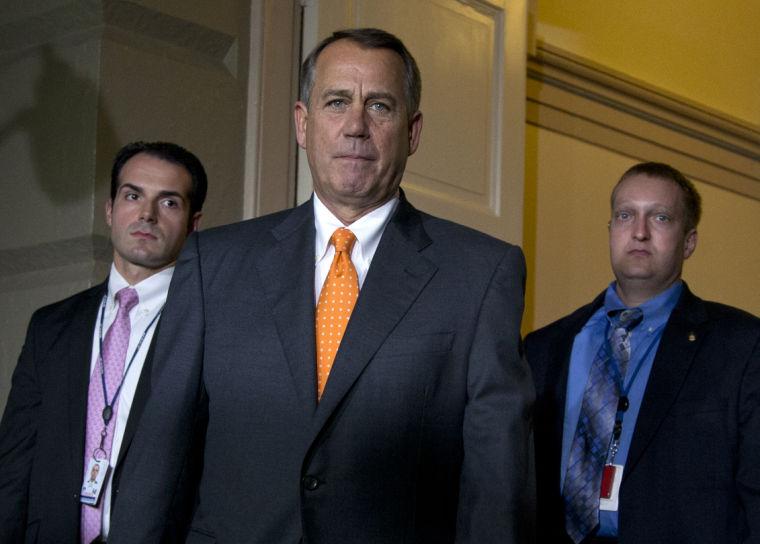 House Speaker John Boehner of Ohio arrives for a meeting with House Republicans in the Capitol in Washington, Wednesday, Oct. 16, Capitol Hill, Wednesday, Oct. 16, 2013, in Washington, after Senate leaders reached last-minute agreement Wednesday to avert a threatened Treasury default and reopen the government after a partial, 16-day shutdown. (AP Photo/Carolyn Kaster)