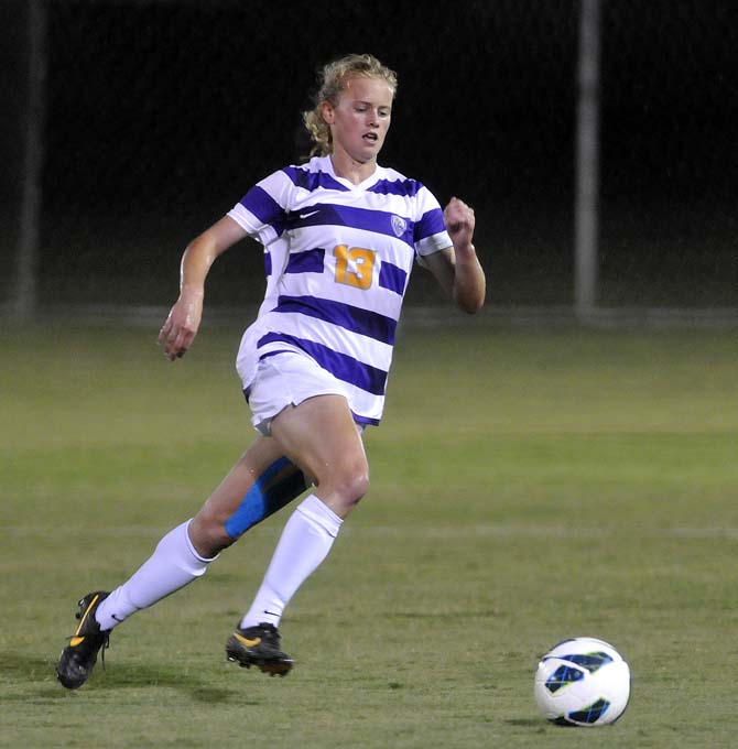 LSU freshman defender Megan Lee (13) moves the ball down the field Friday, Oct. 18, 2013 during LSU's loss to Ole Miss at the LSU Soccer Stadium.