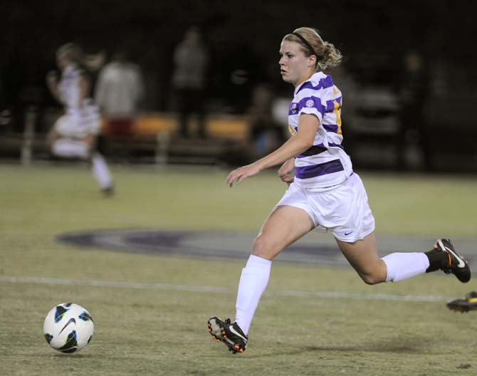 LSU junior midfielder and defender, Alex Arlitt (14), dribbles downfield Friday, Oct. 25, 2013 during the Tigers' 2-1 loss against Georgia.