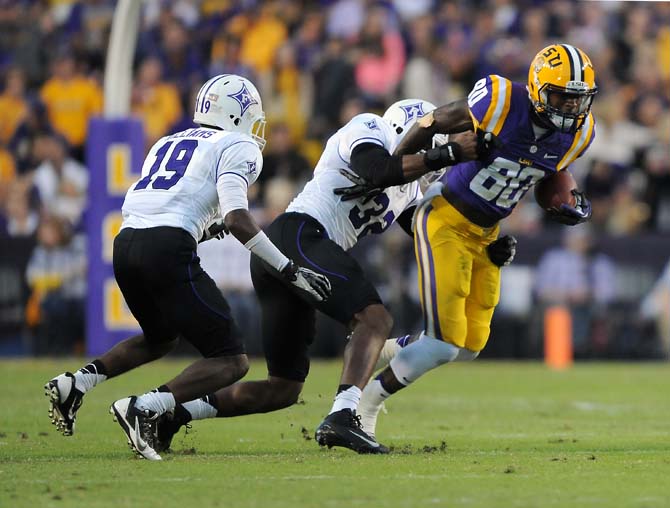 LSU junior wide reciever Jarvis Landry (80) breaks a tackle Saturday, Oct. 26, 2013 during the Tigers' 46-18 win against Furman in Tiger Stadium.