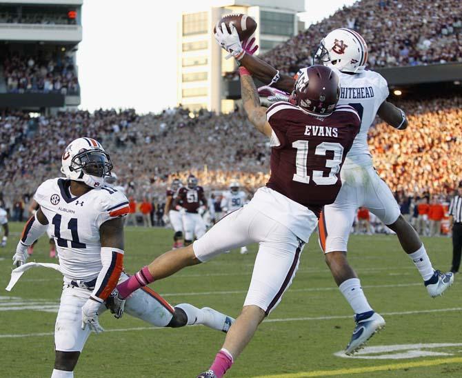 Auburn defensive back Jermaine Whitehead (9) breaks up a pass in the end zone intended for Texas A&amp;M wide receiver Mike Evans (13) as Auburn cornerback Chris Davis (11) looks on in the fourth quarter of an NCAA college football game Saturday, Oct. 19, 2013, in College Station, Texas. Auburn won 45-41. (AP Photo/Bob Levey)