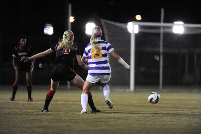 LSU senior midfielder and defender Alex Ramsey (15) and Georgia sophomore forward and defender Caroline Waters (8) fight for the ball Friday, Oct. 25, 2013 during the Tigers' 2-1 loss.