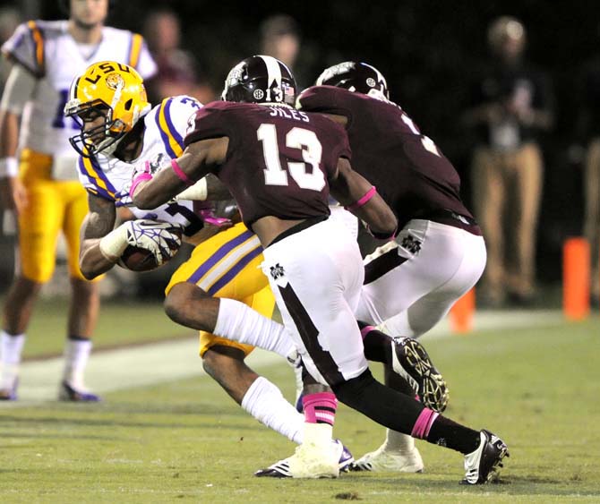 LSU junior wide (3) receiver Odell Beckham Jr gets tackled by an opposing player on Saturday October 5, 2013 during the 59-26 victory against Mississippi State in Davis Wade Stadium.