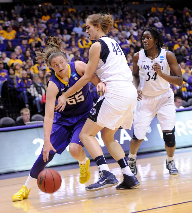 LSU junior forward Theresa Plaisance (55) moves the ball past Penn State sophomore forward Tori Waldner (44) Tuesday March 26, 2013 during the Tigers' 71-66 victory against the Lions in the PMAC.