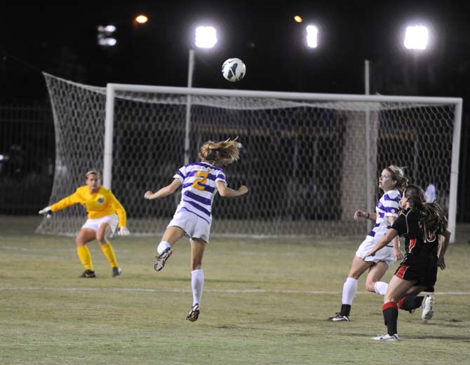 LSU senior defender Addie Eggleston (2) headbuts the ball Friday, Oct. 25, 2013 during the Tigers' loss 2-1