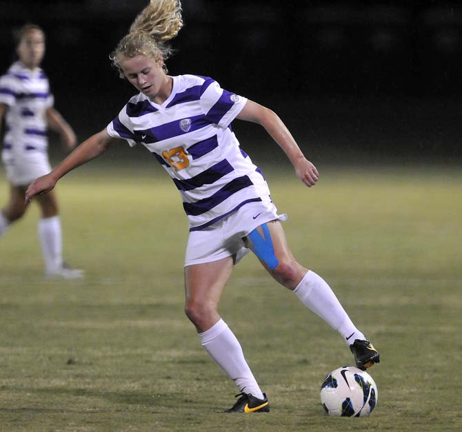 LSU freshman defender Megan Lee (13) regains control of the ball Friday, Oct. 18, 2013 during LSU's loss to Ole Miss at the LSU Soccer Stadium.