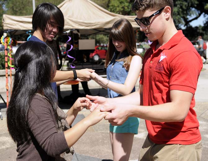 The Hispanic Student Cultural Society promotes Hispanic Heritage Month by offering Salsa dance lessons Wednesday, Oct. 9, 2013, in the Echo Circle of Free Speech Alley.