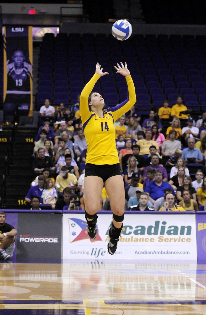 Sophomore setter Malorie Pardo (14) makes a jump set Friday, Sept. 27, 2013, at the Pete Maravich Assembly Center.