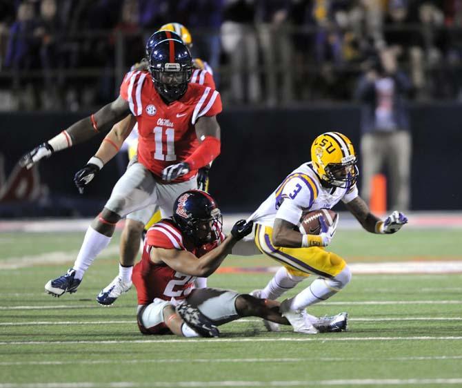 Ole Miss junior defensive back Cody Prewitt (25) pulls down LSU junior wide receiver Odell Beckham Jr. (3) on Saturday, October 19, 2013 during the Tigers' 27-24 loss against the Rebels at Vaught-Hemingway Stadium.