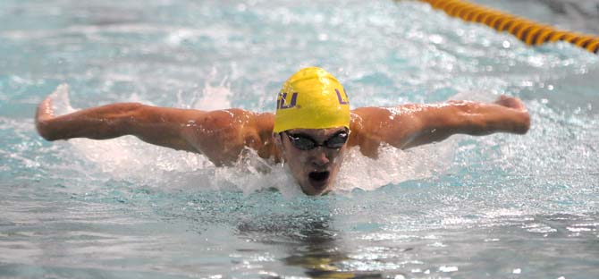 LSU sophomore Grant Grenfell takes a breath during the men's 200 yard butterfly event on Friday October 18, 2013 at the LSU vs. Georgia swim meet in the Natatorium.