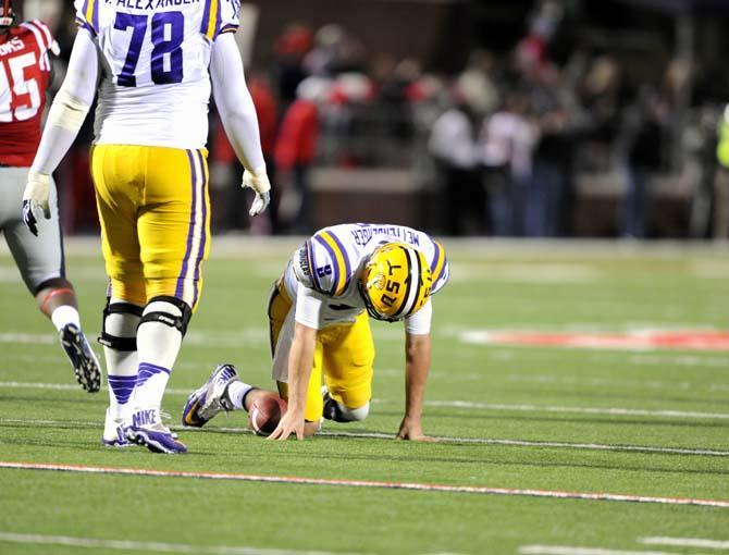 Senior quarterback Zach Mettenberger (8) falls to his knees Saturday, October 19, 2013 during the Tigers' 27-24 loss against Ole Miss at Vaught-Hemingway Stadium.