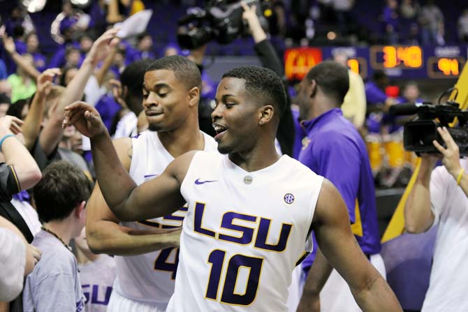 LSU junior guard Andre Stringer (10) celebrates with fans and teammates Saturday, Feb. 23, 2013 after the Tigers' 97-94 tripple overtime victory against the Crimson Tide. Stringer scored 10 out of the Tigers' 97 points.