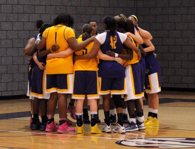 The LSU Lady Tigers huddle before starting practice on Tuesday afternoon, Oct. 1, 2013 in the LSU Basketball Practice Facility.