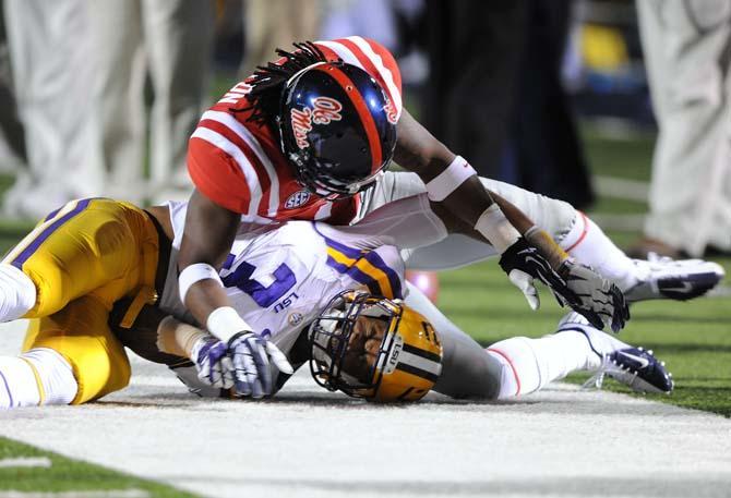 Ole Miss defensive back Trae Elston (7) tackles LSU junior wide receiver Odell Beckham Jr. (3) Saturday, October 19, 2013 during the Tigers' 27-24 loss against the Rebels at Vaught-Hemingway Stadium.