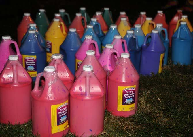 All the jugs of paint sit ready to be used on Monday, October 21, 2013, during the Splatterbeat homecoming week event on the Parade Ground.