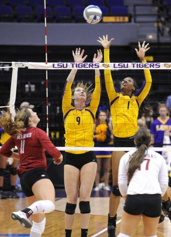 LSU junior middle blocker Madi Mahaffey (9) and sophomore middle blocker Khourtni Fears (1) attempt to block the ball Sunday, October 27, 2013 during the Tigers' 3-2 victory against Arkansas at the PMAC.