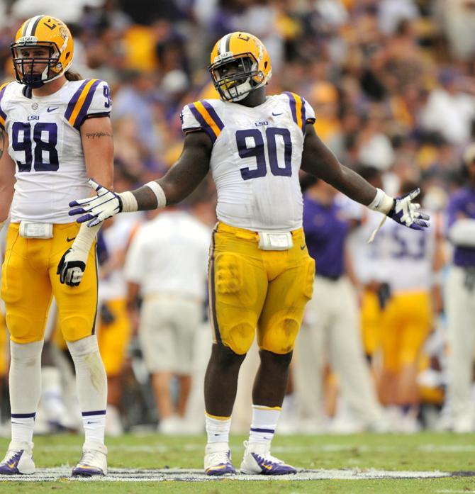 LSU junior defensive tackle Anthony Johnson (90) celebrates the start of the fourth quarter during the 17-6 victory against Florida in Tiger Stadium.