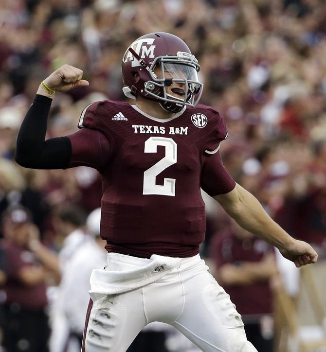 Texas A&amp;M quarterback Johnny Manziel (2) celebrates after throwing a touchdown pass to Malcome Kennedy during the third quarter of an NCAA college football game against Mississippi State Saturday, Nov. 9, 2013, in College Station, Texas. (AP Photo/David J. Phillip)