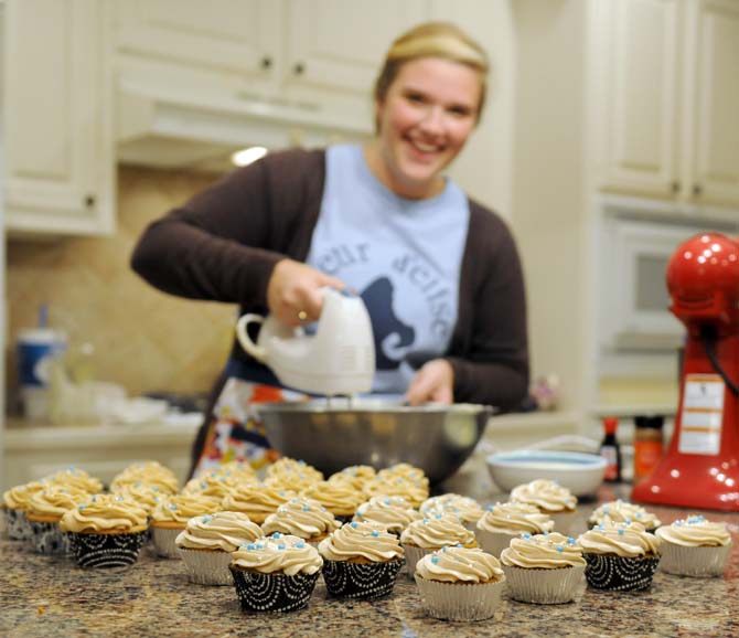 LSU Spanish junior Elise Abshire of Fleur D'Elise Treats mixes cream cheese icing for her homemade cupcakes Monday, Nov. 11, 2013 in her home in Baton Rouge.