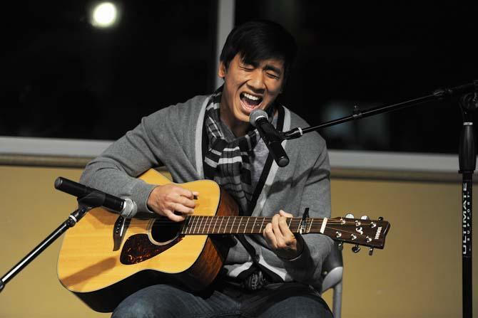 VSA member, senior, Chris Nguyen performs with his guitar Tuesday, Nov. 12, 2013 during the VSALSU Spotlight II Performance in the LSU Union Live Oak Lounge.