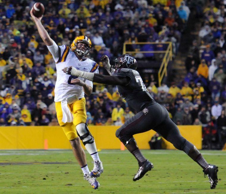 LSU senior quarter back Zach Mettenberger (8) throws a pass Saturday Nov. 23, 2013 during the Tigers' 34-10 victory against Texas A&amp;M in Tiger Stadium.