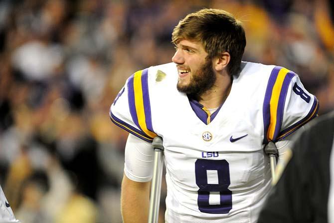 LSU senior quarterback Zach Mettenberger (8) looks on Friday, Nov. 29, 2013 as his teammates complete the final plays of the Tigers' 31-27 victory against Arkansas in Tiger Stadium.