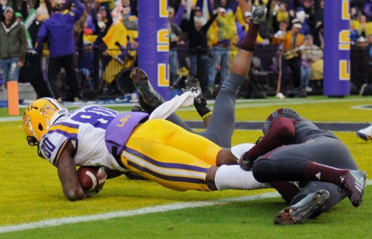 LSU junior wide receiver Jarvis Landry (80) scores a touchdown Saturday Nov. 23, 2013 during the Tigers' 34-10 victory against Texas A&amp;M in Tiger Stadium.