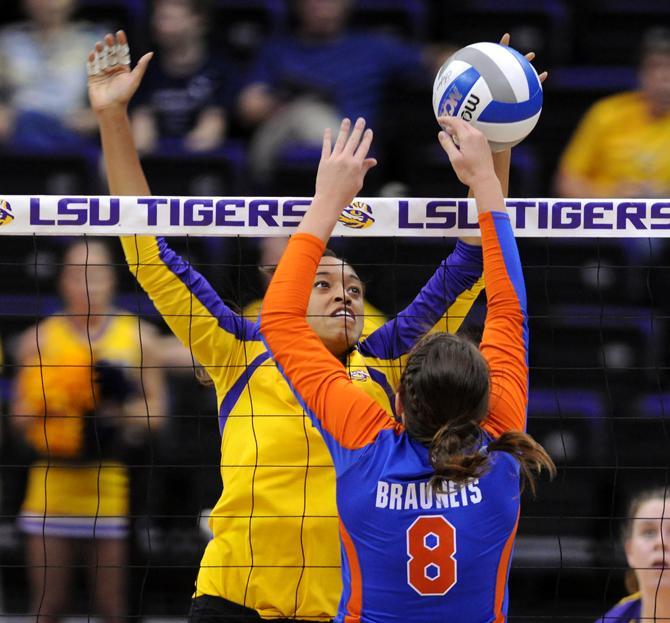 LSU senior middle blocker Desiree Elliott (4) attempts to block Florida senior setter Taylor Brauneis (8) hit Friday, Nov. 1, 2013 during the Tiger's 3-1 loss to the Florida Gators in the PMAC.