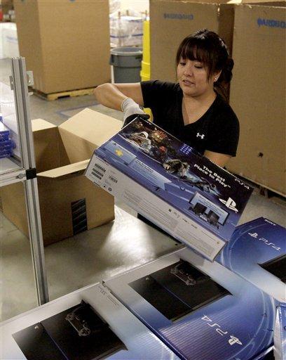 IMAGE DISTRIBUTED FOR AMAZON - In this image released on Tuesday, Nov. 12. 2013, an Amazon Fulfillment Center preparing for its Release-Date Delivery of the Sony PlayStation 4 Launch Edition. (Rick Scuteri/AP Images for Amazon)