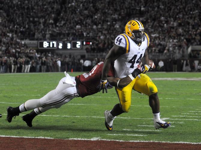 LSU senior fullback J.C. Copeland (44) fumbles the ball Saturday, Nov. 9, 2013 during the Tiger's 38-17 loss to the Alabama Crimson Tide at Bryant-Denny Stadium in Tuscaloosa, AL.