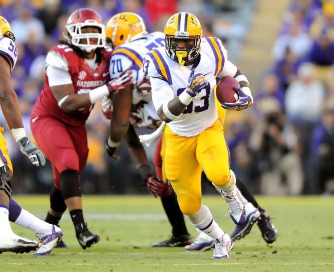 LSU sophomore running back Jeremy Hill (33) maneuvers downfield Friday, Nov. 29, 2013 during the Tigers' 31-27 victory against Arkansas in Tiger Stadium.