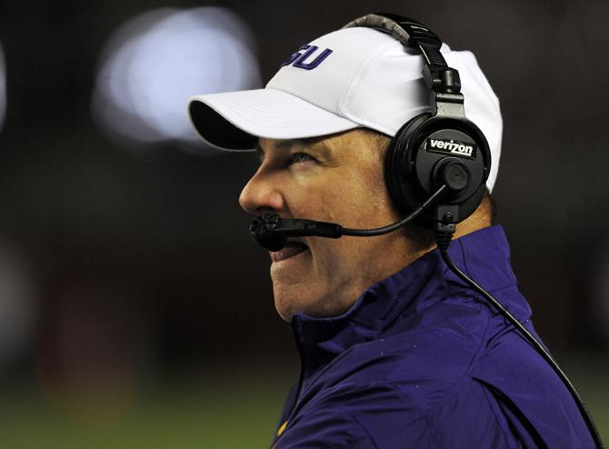 LSU head coach Les Miles watches a replay Saturday, Nov. 9, 2013 during the Tiger's 38-17 loss to the Alabama Crimson Tide at Bryant-Denny Stadium in Tuscaloosa, AL.