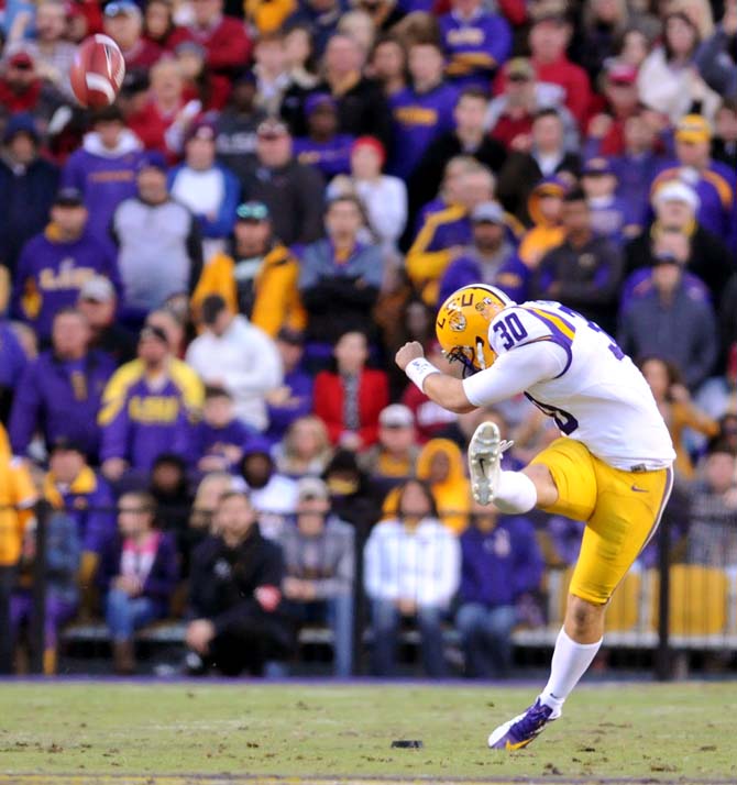 LSU junior placekicker James Hairston (30) kicks the football after an LSU touchdown Friday, Nov. 29, 2013 during the Tigers' 31-27 victory against Arkansas in Tiger Stadium.