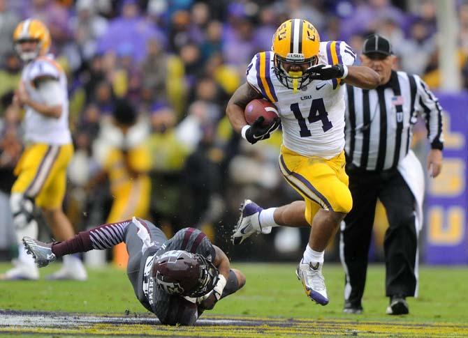 LSU junior running back Terrence Magee (14) runs down the field Saturday, Nov. 23, 2013 during LSU's 34-10 victory against Texas A&amp;M in Tiger Stadium.