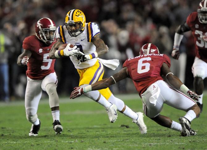 LSU junior wide receiver Odell Beckham Jr. (3) attempts to evade Alabama junior defensive back Ha Ha Clinton-Dix (6) on Saturday, Nov. 9, 2013 during the Tiger's 38-17 loss to the Alabama Crimson Tide at Bryant-Denny Stadium in Tuscaloosa, AL.