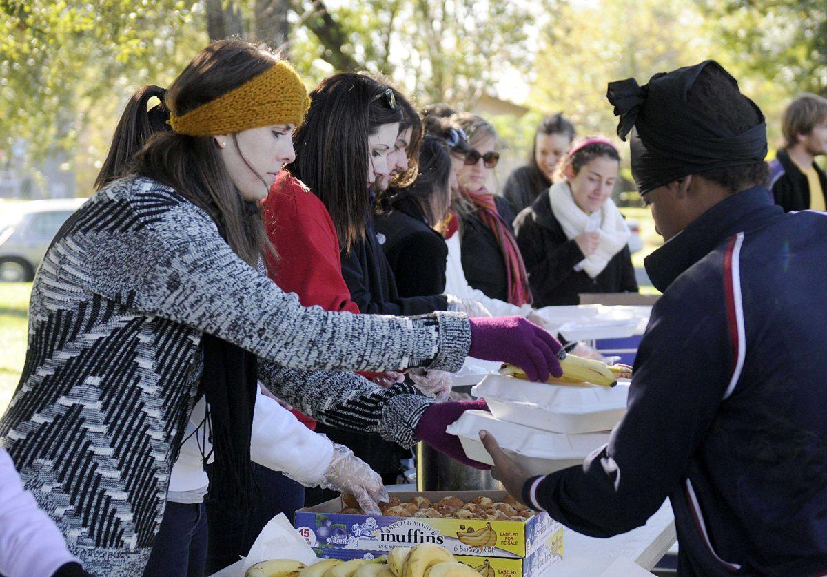 LSU student Lindsey Gould volunteers with Kitchens on the Geaux Sunday morning Nov. 24, 2013 at Expressway Park.