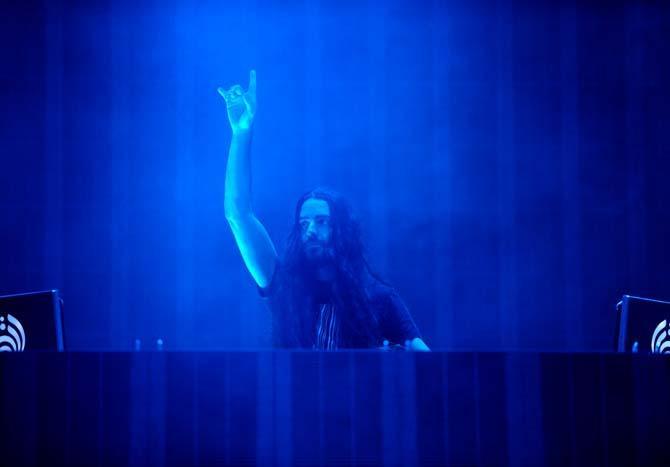 Lorin Ashton, known by his stage name Bassnectar, pumps up the crowd during his set on the Le Plur Stage on Sunday Nov. 3, 2013 at the 2013 Voodoo Music + Arts Experience.