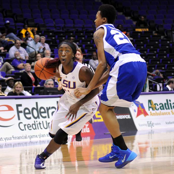 LSU freshman guard Raigyne Moncrief (11) drives toward the basket Wednesday, Nov. 20, 2013 during the Lady Tiger's 73-54 vitory against Hampton Lady Pirates in the PMAC.