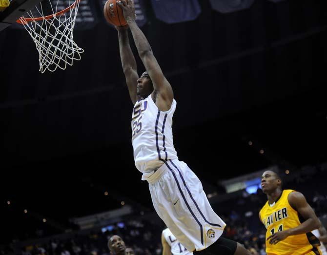 LSU freshman forward Jordan Mickey (25) launches the ball towards the hoop Wednesday, Nov. 6, 2013, during the Tigers' 80-45 victory at the Pete Maravich Assembly Center